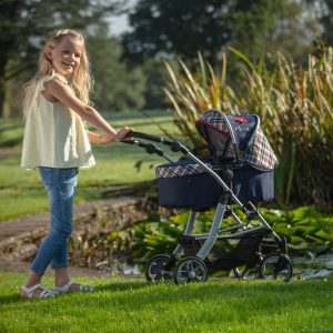 image of a girl pushing the daisy chain connect 5 in 1 dolls pram