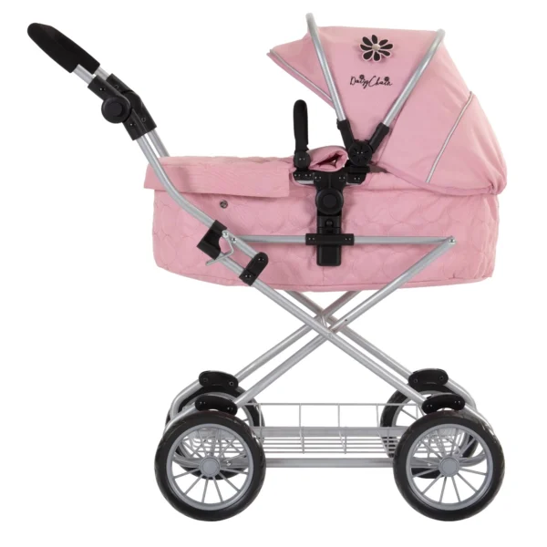 Daisy Chain Destiny Travel System Pram in Classic Pink fabric shown side on with handle on the left. Hood is up and is pink with accents of Silver metal with a black and pink flower rosette and an with an embroidered Daisy Chain logo in Black. Wheels are black and Silver with a shopping basket at bottom of pushchair which is Silver, like the frame. The frame of the pushchair is silver.