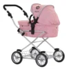 Daisy Chain Destiny Travel System Pram in Classic Pink fabric shown on an angle with handle on the left. Hood is up and is pink with accents of Silver metal with a black and pink flower rosette and an with an embroidered Daisy Chain logo in Black. Wheels are black and Silver with a shopping basket at bottom of pushchair which is Silver, like the frame. The frame of the pushchair is silver.