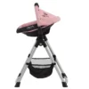 Daisy Chain Unity High Chair/Car Seat in Classic Pink fabric. Car seat is in Classic Pink and black fabric with an embroidered Daisy Chain logo in black on the hood. It sits on a silver A-frame with a handy basket underneath for storage.