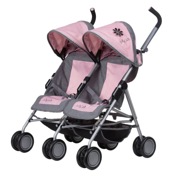 Daisy Chain Zipp Twin Max Dolls Pushchair in Classic pink fabric. Shown at an angle facing left. The pushchair has 2 seats side-by-side in the pink fabric with accents of grey and an embroidered Daisy Chain logo in silver. The pushchair has two hoods partly up and are mainly pink with accents of grey with a black and pink flower rosette. The wheels are black. The frame is silver and the two shopping baskets at bottom of the pushchair are black.