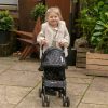 image of a young girl pushing the daisy chain little zipp dolls pushchair in limited edition twighlight pattern