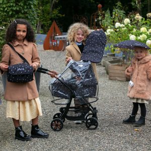 three young girls in a garden demonstating the daisy chain zipp zenith dolls pram acessory pack in limited edition twighlight pattern