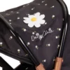 Daisy-Chain-Connect-5-in-1-Dolls-Pram-in-Limited-Edition-Twilight. Black fabric with little daisies. White daisy rosette on the hood. The pram frame is black and has accents of rose gold.