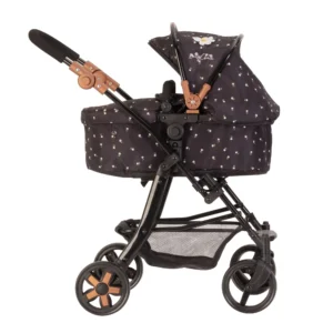 Daisy-Chain-Connect-5-in-1-Dolls-Pram-in-Limited-Edition-Twilight. Black fabric with little daisies. White daisy rosette on the hood. The pram frame is black and has accents of rose gold.
