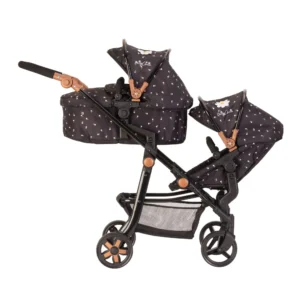 A stunning Daisy Chain Pinnacle Dolls Pram Limited Edition Twilight designed for children aged 7 to 13 years. The pram features a sleek black frame with elegant rose gold accents, making it a truly exquisite piece. Its Limited Edition Twilight fabric which is black with little daisies adds a touch of magic, complemented by intricate rose gold trim detailing. The pram is equipped with swivel wheels for easy maneuverability and boasts a comfortable soft-grip black handle for effortless pushing. Additionally, it includes a convenient black shopping basket for storing dolls' essentials.