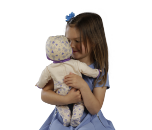 image of a girl with a susie interactive doll