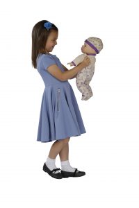 image of a girl in a blue dress holding a doll