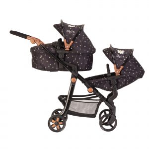 image shows a double dolls pram in black with white daisies