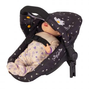image shows a car seat for a baby doll