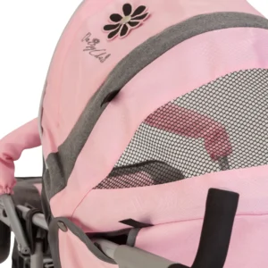 Daisy Chain Zipp Zenith Dolls Pushchair in Classic Pink fabric. Close up of hood showing the daisy rosette which has black petals and a silver centre. Underneath this is an embroidered Daisy Chain logo in silver. To the right is a strip of the grey fabric.