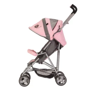 Daisy Chain Zipp Zenith Dolls Pushchair in Classic Pink fabric shown side on with the handles on the right side. Hood is mainly pink with accents of grey fabric with a black and pink flower rosette. Seat is in pink and grey fabric with an embroidered silver Daisy Chain log with a pink bumper bar across the front of the seat. Wheels are black and swivel. With shopping basket at bottom of pushchair which is black. The frame is silver.