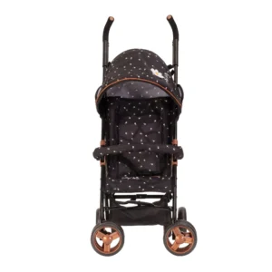 Daisy Chain Zipp Zenith Dolls Pushchair in Limited Edition Twilight fabric shown head on with the handles at the back. Hood is black with little daisies on the fabric with a white daisy rossette with a yellow centre on the side of the hood. Seat is black with daisies on it. It has a rose gold trim with an embroidered white Daisy Chain logo. The pushchair features a black bumper bar that can be raised up and down to make it easy to get your doll in and out of the pushchair. Wheels are rose gold with black tyres. With shopping basket at bottom of pushchair which is black. The frame of the pushchair is black with accents of rose gold.