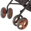 Daisy Chain Zipp Zenith Dolls Pushchair in Limited Edition Twilight fabric. Showing a close up of the swivel wheels in rose gold with black tyres.