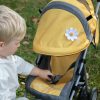 an image of a boy playing with the daisy chain little zipp dolls pushchair in sunflower yellow