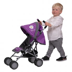 image of a blonde boy playing with the daisy chain little zipp dolls pushchair in lavender