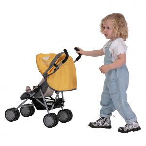 image of a girl playing with the daisy chain little zipp dolls pushchair in sunflower yellow