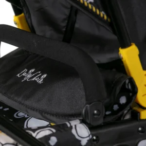 Detail of Daisy Chain Connect Dolls Pram apron and bumper bar. Bumper bar in black EVA foam and apron with Daisy Chain logo embroidery