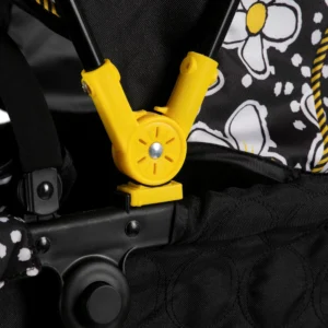 Daisy Chain Destiny Travel System Dolls Pram in Bumblebee fabric. Close up of hood with yellow plastic part that slots onto the black cot.