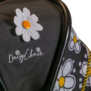Daisy Chain Destiny Travel System Dolls Pram in Bumblebee fabric. Close up of the hood showing daisy flower rosette and embroidered Daisy Chain logo. Bumblebee fabric detail and black/yellow striped trim detail.