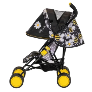 Daisy Chain Little Zipp Dolls Pushchair in Bumblebee fabric shown side on with the handles on the right side. Hood is down and is mainly black with bumblebee fabric at the back. Wheels are yellow and shopping basket at bottom of pushchair is black