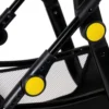 Daisy Chain Pinnacle Double Dolls Pram in Bumblebee fabric for ages 6-13 years old. Close up image of the black frame and yellow buttons on the side of the frame. Part of the mesh shopping basket is visible.