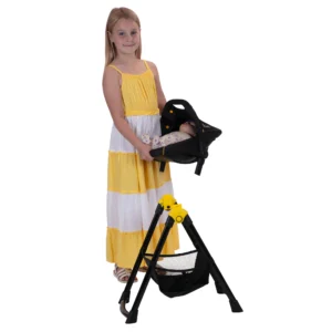 Daisy Chain Unity High Chair/Car Seat in Bumblebee fabric. Car seat shown in bumblebee fabric with a black canopy. It sits on a black A-frame with a handy basket underneath for storage.. Girl in yellow and white striped summer dress is holding the car seat.