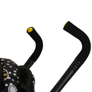 Daisy Chain Zipp Max Dolls Pushchair in Bumblebee fabric showing close up of handles which has yellow ends to co-ordinate with the pushchair. Handles are adjustable from 76-82cm