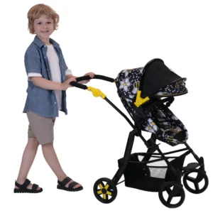 Boy pushing the Connect 5 in 1 Dolls Pram in pushchair mode. The pram has a bumblebee fabric, black frame and yellow accents