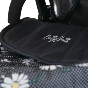 Daisy Chain Destiny Travel System Pram in Daisy Dot fabric. Close up of the apron with an embroidered Daisy Chain logo in white and a quilted finish to the fabric.