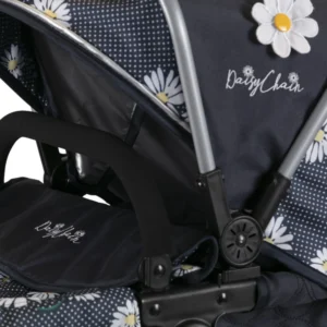 Daisy Chain Destiny Travel System Pram in Daisy Dot fabric. Close up of hood on the side with the daisy dot fabric, which is navy blue with big white daisies and white polka dots.